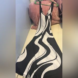 This is a black and white maxi dress with criss-cross strips in the back.